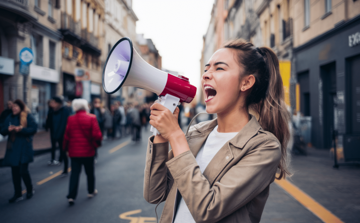 a woman shouting with a megaphone
