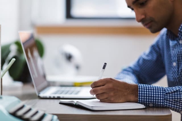 A man sitting at the desk.