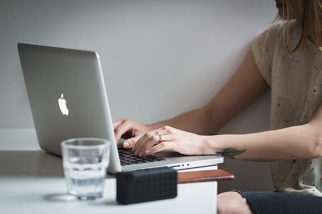 A woman working on a computer.