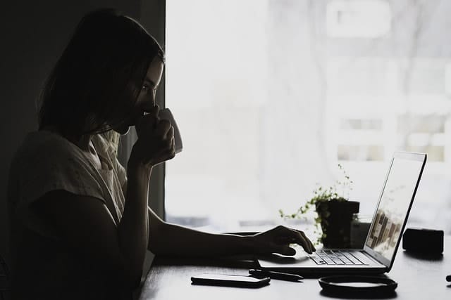 A person working on a laptop.