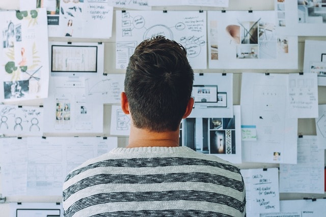 A man thinking over his notes.